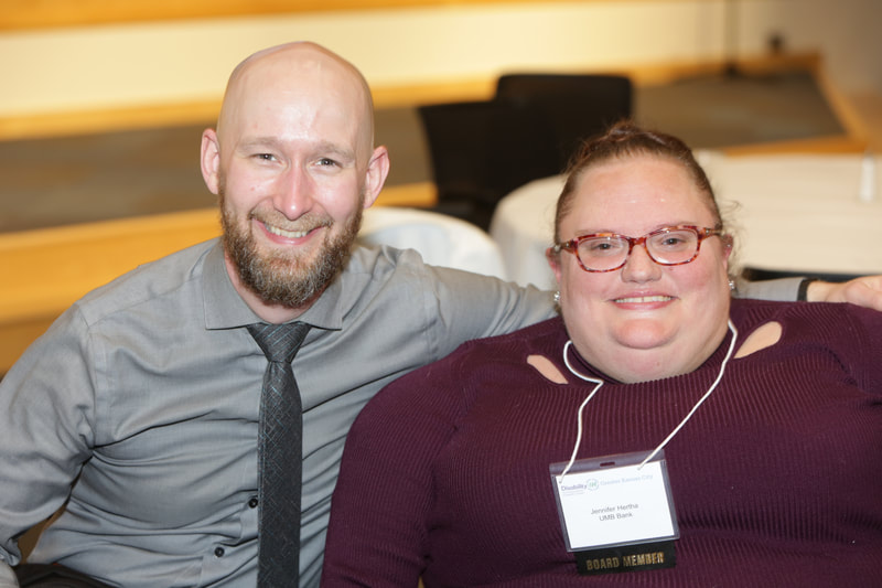 Michael Murray, ODEP and keynote speaker smiling at camera with Jennifer Hertha, UMB and Disability:IN GKC board member