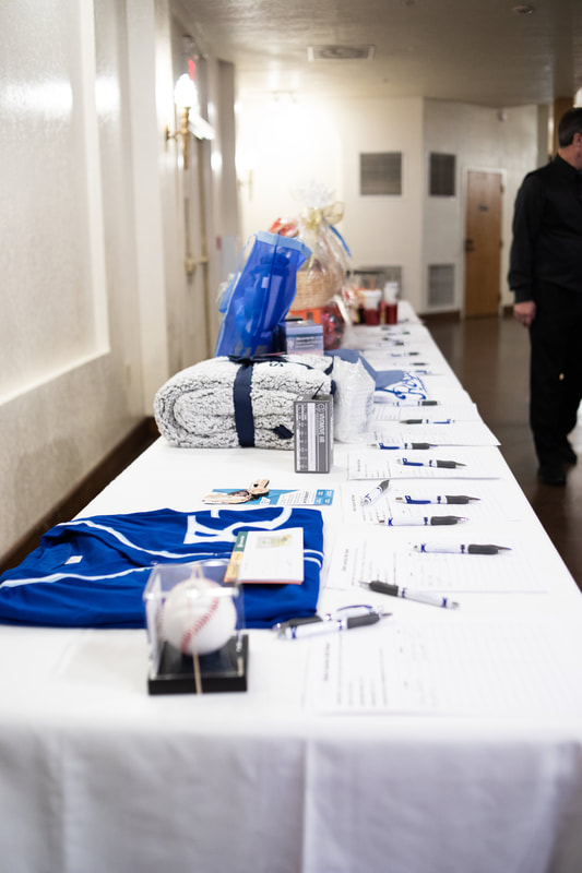 silent auction table with KC Royals items